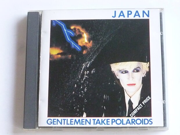 Japan - Gentlemen take polaroids
